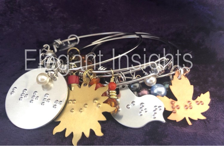 Photo of all four Charmed by the Seasons Expandable Dangle Bangles, from left, winter, summer, spring, fall.